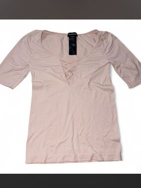 Bebe pink top with criss cross detail